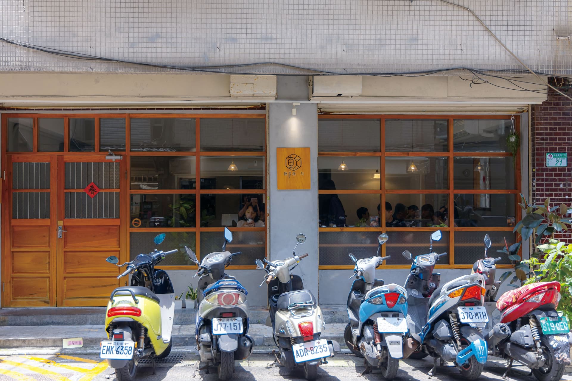 Rows of scooters parked on a street in Taiwan